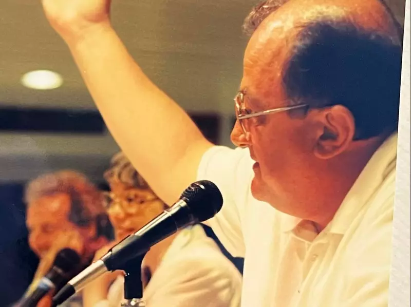 Moe Lauzier at a microphone